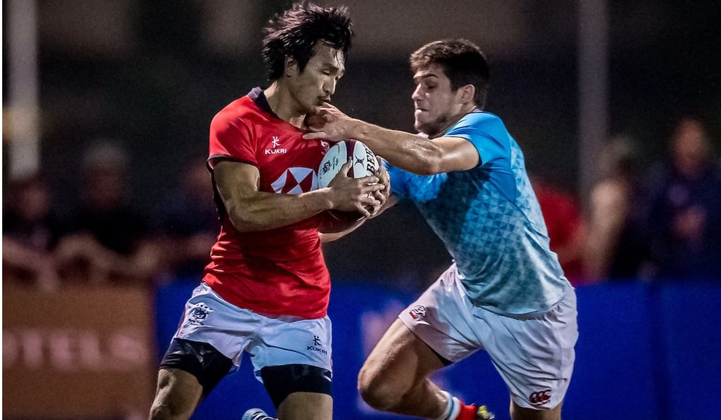 Hong Kong’s try scorer Salom Yiu tries to shrug off a tackle. Hong Kong’s try scorer Salom Yiu tries to shrug off a tackle.