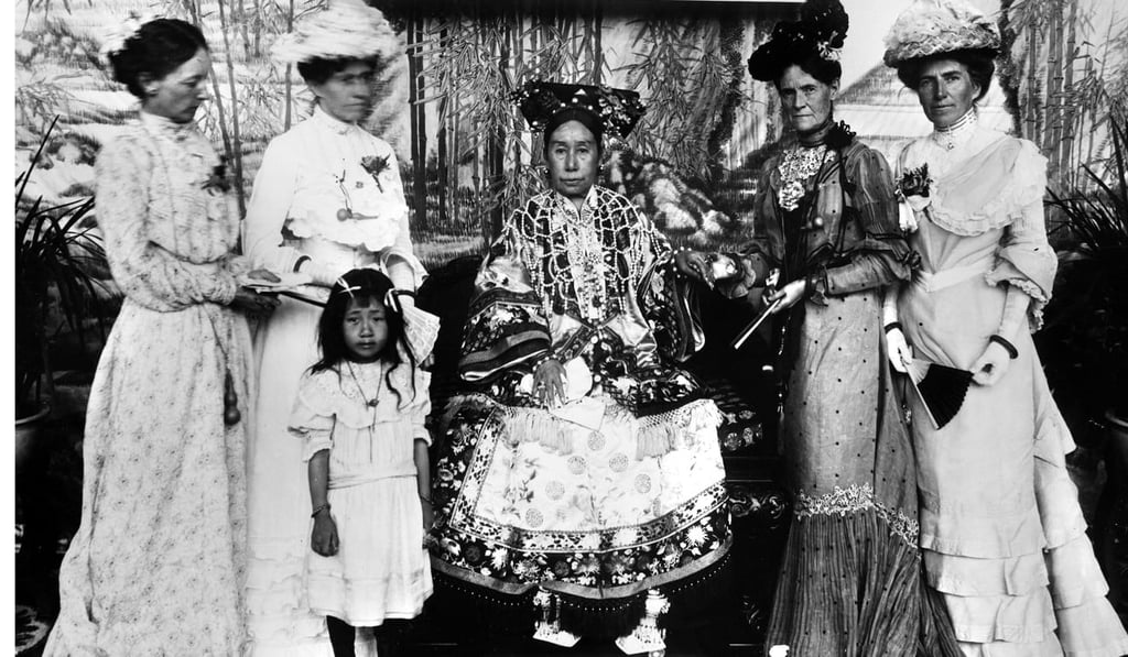 The Empress Dowager Cixi (centre) in 1902 on her return to Peking, with the wives of foreign diplomats. Photo: Alamy