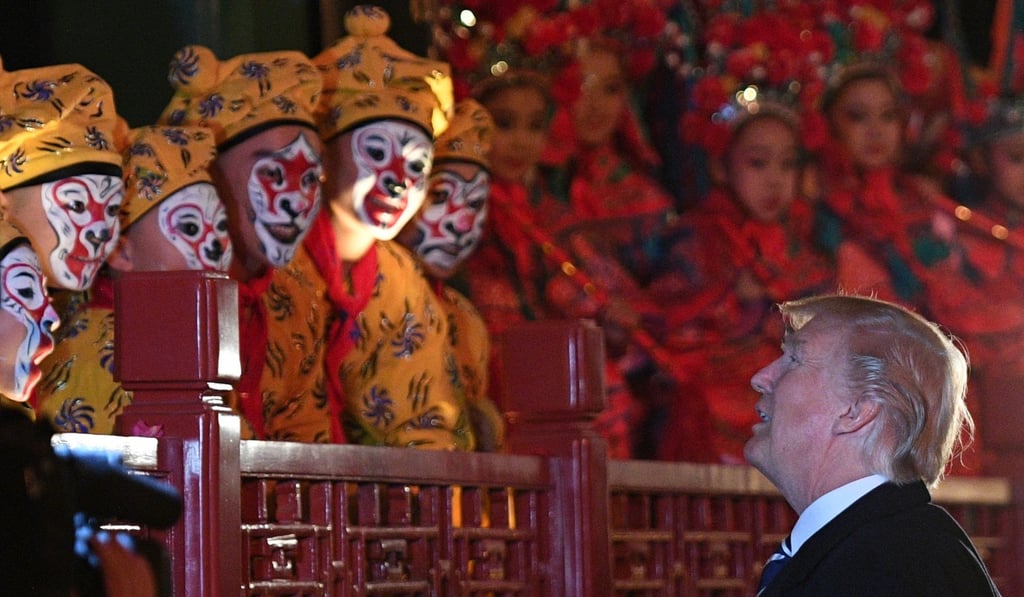 US President Donald Trump talks to opera performers at the Forbidden City in Beijing on Wednesday. Photo: AFP