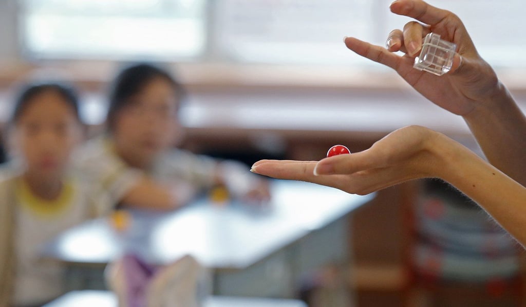 Just the trick: some of the school’s pupils learn magic. Photo: K. Y. Cheng