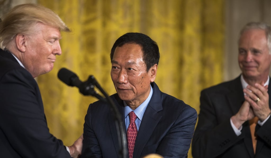 Foxconn’s Terry Gou (centre) with US President Donald Trump (left), at the July 26 White House ceremony to announce the LCD factory project. Photo: EPA