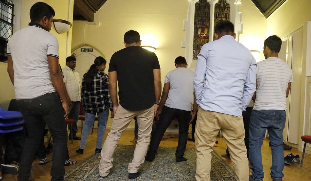Sri Lankans, many of whom said they were tortured in their home country, gather at a church in London. Photo: AP Sri Lankans, many of whom said they were tortured in their home country, gather at a church in London. Photo: AP