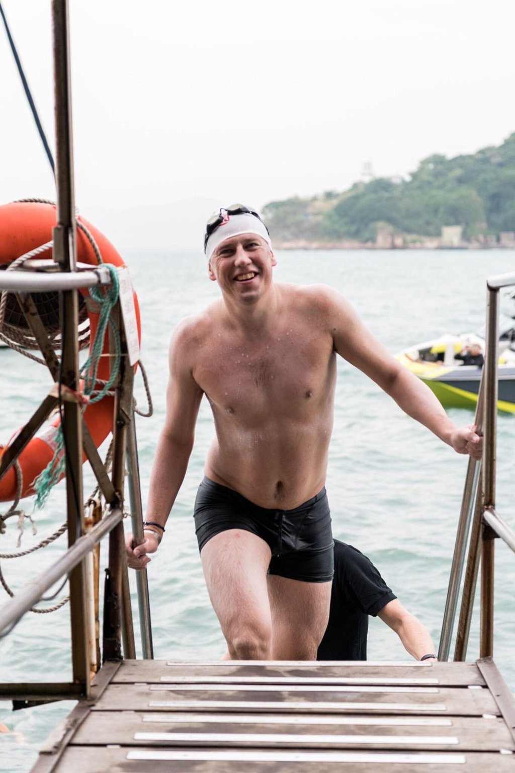 Simon Holliday completes his swim and gets ready to celebrate.