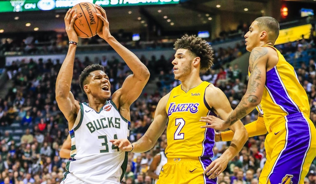 Bucks forward Giannis Antetokounmpo drives to the basket on Lakers guard Lonzo Ball. Photo: EPA