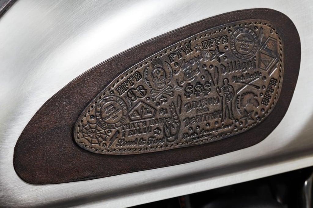 A close-up of the leather insert and detailing on the petrol tank of one of Angry Lane’s customised motor bikes. Photo: Jason Bonello