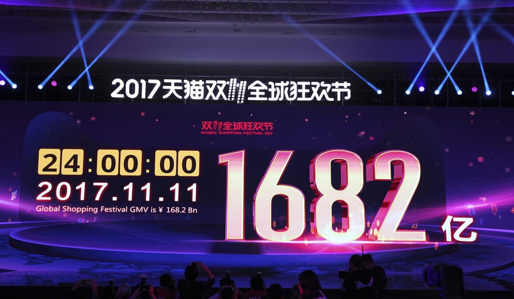 A big screen at the media centre for the Singles’ Day shopping festival shows the total value of transactions at 168 billion yuan (US$25.3 billion). Photo: Simon Song