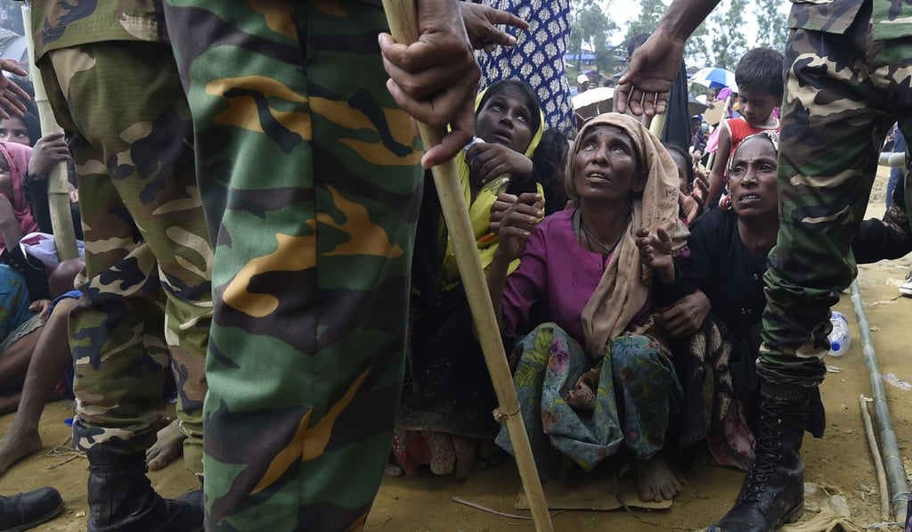 Rohingya refugees wait for food distribution organised by the Bangladesh army at the Balukhali refugee camp, near Gumdhum, on September 25. Photo: AFP