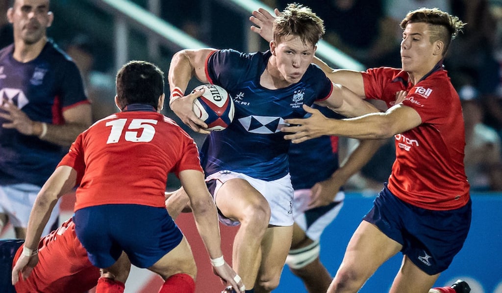 Hong Kong winger Marcus Ramage is swamped by the Chile defence. Hong Kong winger Marcus Ramage is swamped by the Chile defence.