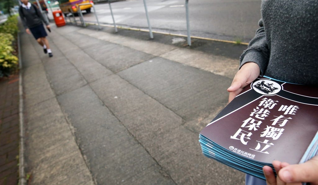 Localist group Hong Kong National Front distributing pro-independence fliers at Stewards Pooi Kei College in Sha Tin. Photo: David Wong