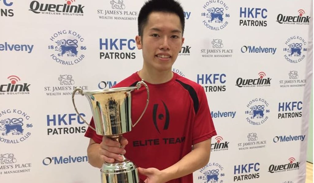Leo Au poses with the HKFC PSA International Squash Open trophy. Photo: HKFC