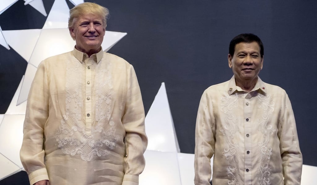 US President Donald Trump and Philippine President Rodrigo Duterte in their barong tagalog at the SMX Convention Centre in Manila. Photo: AP