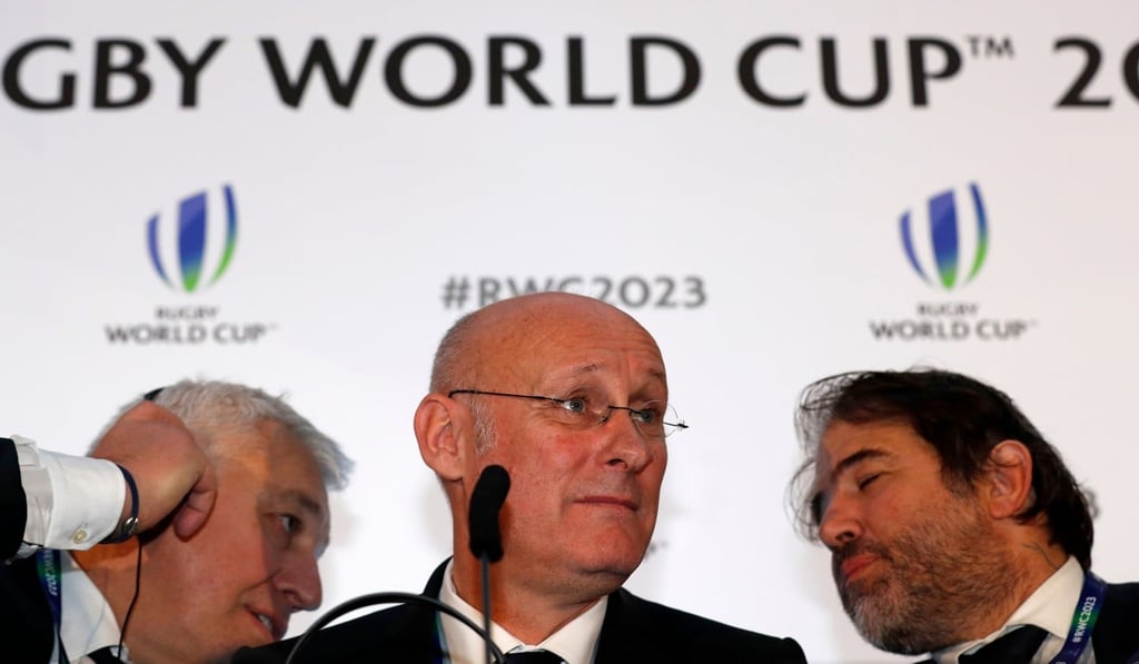 French rugby president Bernard Laporte (centre) gives an interview after France are named to host the 2023 Rugby World Cup. Photo: AFP