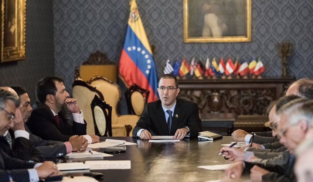 Jorge Arreaza, Venezuela's minister of foreign affairs, centre, meets the European Union (EU) diplomatic corps at the Yellow House (Casa Amarilla) in Caracas, Venezuela. EU nations decided to adopt targeted sanctions against Venezuela, including an “embargo on arms and on related material that might be used for internal repression.” Photo: Bloomberg