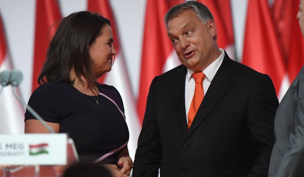 Hungarian Prime Minister Viktor Orban chats with Hungarian Minister of State for Family and Youth Affairs Katalin Novak (L) in the capital of Budapest. Photo: AFP