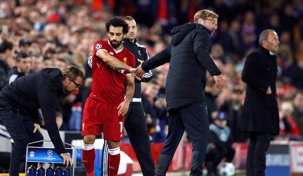 Jurgen Klopp shakes hands with Mohamed Salah after he is substituted off in Liverpool’s win against Maribor. Photo: Reuters