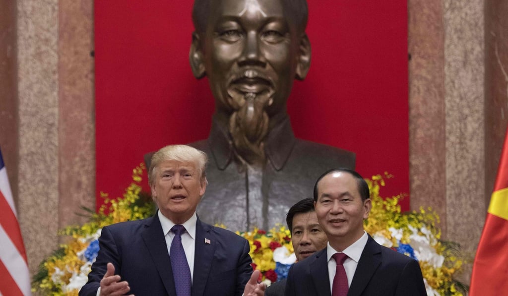 US President Donald Trump and Vietnamese President Tran Dai Quang meet in Hanoi in front of a statue of Ho Chi Minh. Photo: AFP