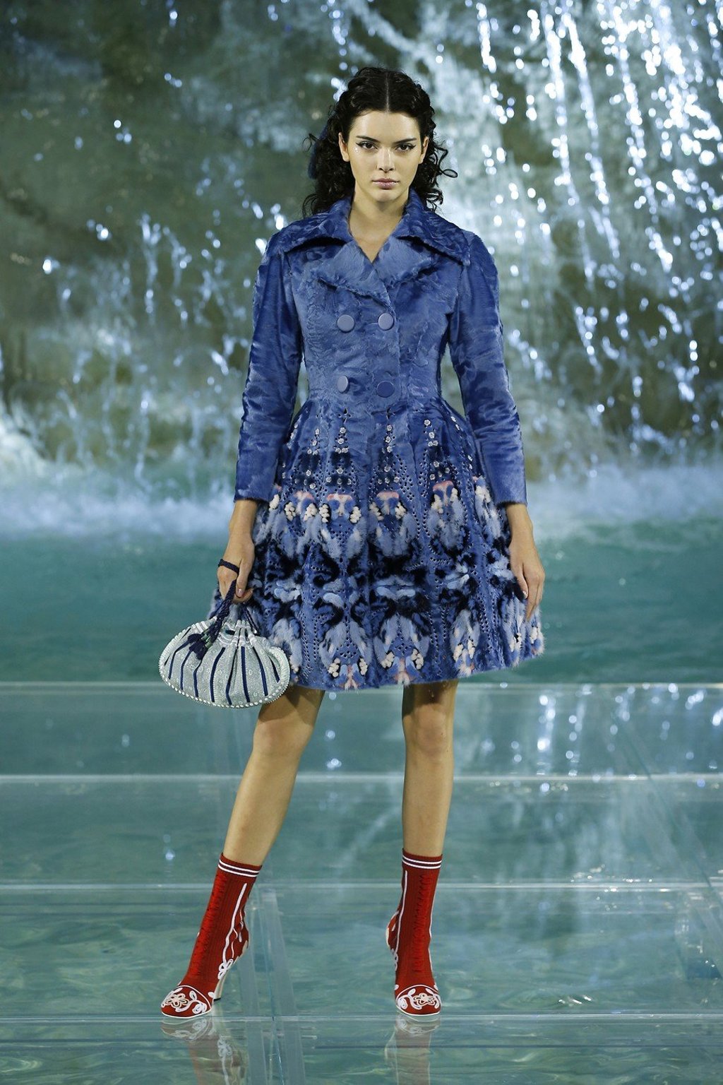 Fendi shows autumn/winter 2016 collection at Rome's iconic Trevi Fountain. Celebrity model Kendall Jenner joined other models walking on a crystal runway on top of the monument.
