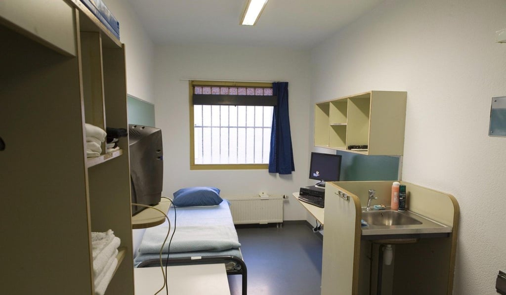 A typical cell at the ITCY's Detention Unit in Scheveningen prison. Each cell contains a bed, desk, shelving, cupboard, toilet, hand basin, TV and computer that does not have internet access. File photo: EPA