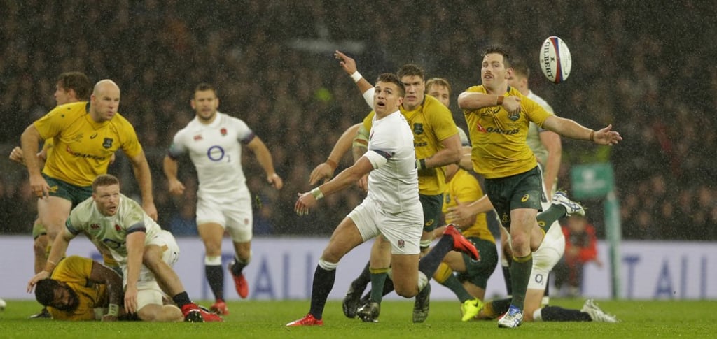 Australia’s Bernard Foley (R) passes the ball. Photo: AP