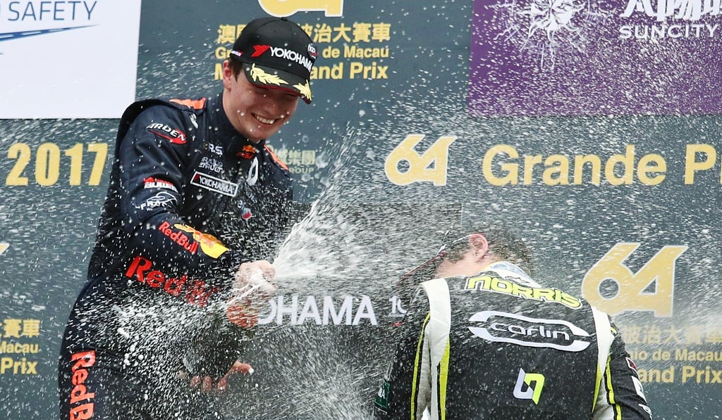Daniel Ticktum pours on the bubbly.