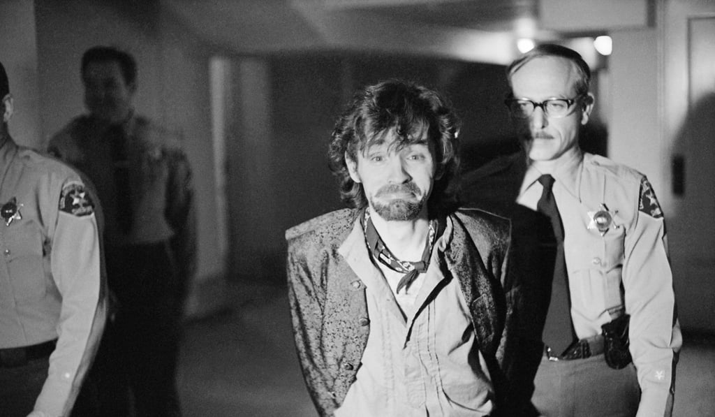 In this December 21, 1970 file photo, Charles Manson reacts to photographers as he goes to lunch after an outbreak in court that resulted in his ejection, along with three female co-defendants, in the Sharon Tate murder trial. Photo: AP