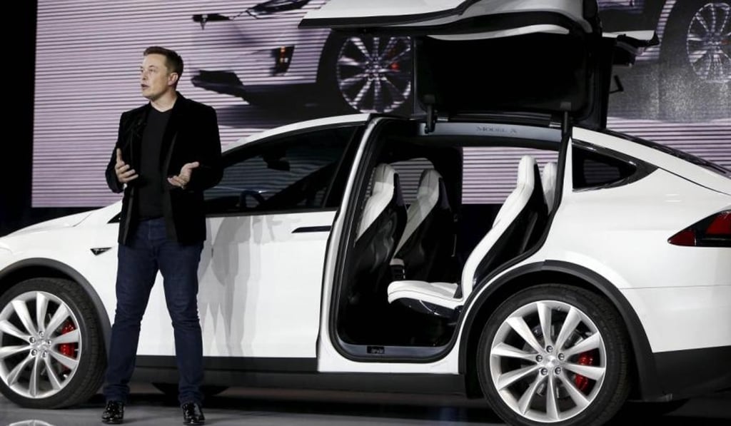 Tesla Motors’ CEO Elon Musk introduces the falcon wing door on the Model X electric sports-utility vehicle in Fremont, California. Photo: Reuters