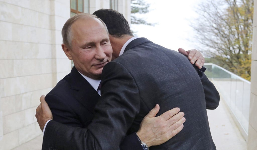 Russian President Vladimir Putin hugs Syrian President Bashar al-Assad in the Bocharov Ruchei residence in the Black Sea resort of Sochi, Russia. Photo: AP