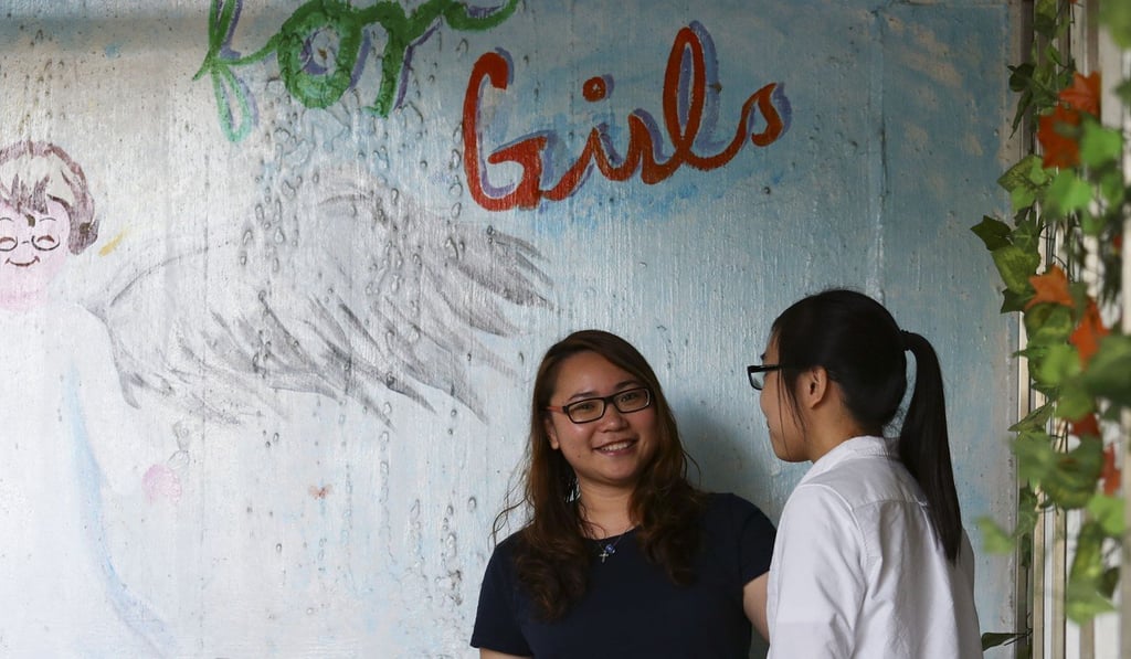 Elf Wong (left) with Man, 23, a former resident. Photo: Nora Tam