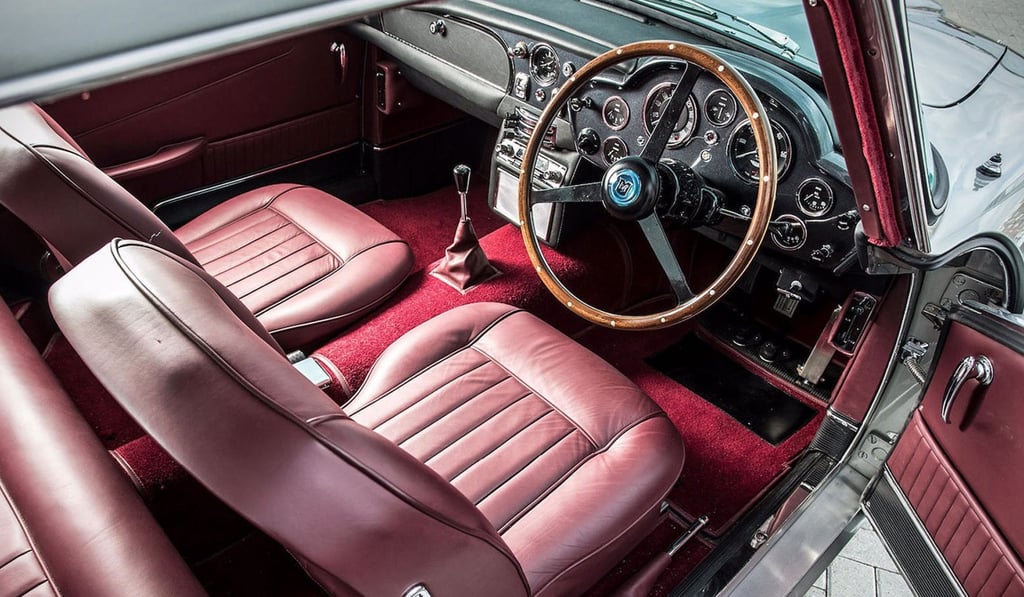 The luxurious interior of Paul McCartney’s 1964 Aston Martin DB5 has been reworked to dark red. The luxurious interior of Paul McCartney’s 1964 Aston Martin DB5 has been reworked to dark red.