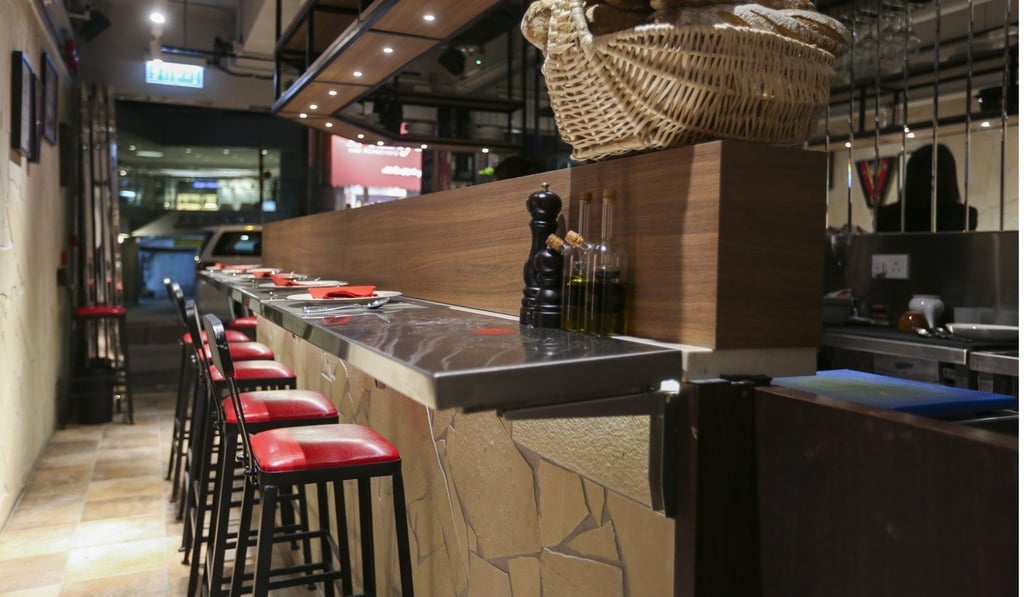 At Rare Restaurant in Central you can sit upstairs on high stools around the bar space. Photo: Xiaomei Chen