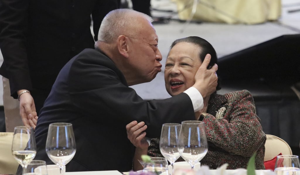 Tung Chee-hwa gives his wife Betty Tung Chiu Hung-ping a kiss at the third anniversary event. Photo: Felix Wong