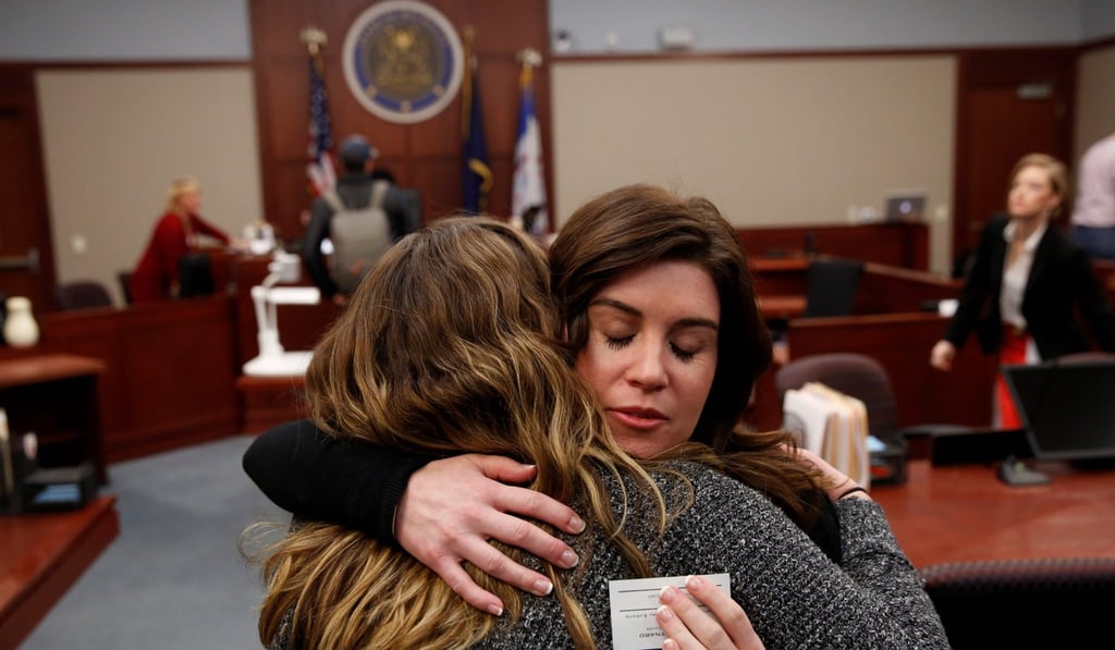 Larissa Boyce (R) gets a hug from Alexis Alvarado, both victims of Larry Nassar, during a hearing in Ingham County Circuit Court on November 22, 2017 in Lansing, Michigan. Former USA Gymnastics team doctor Nassar, accused of molesting dozens of female athletes over several decades, on Wednesday pleaded guilty to multiple counts of criminal sexual conduct. Photo: AFP Larissa Boyce (R) gets a hug from Alexis Alvarado, both victims of Larry Nassar, during a hearing in Ingham County Circuit Court on November 22, 2017 in Lansing, Michigan. Former USA Gymnastics team doctor Nassar, accused of molesting dozens of female athletes over several decades, on Wednesday pleaded guilty to multiple counts of criminal sexual conduct. Photo: AFP