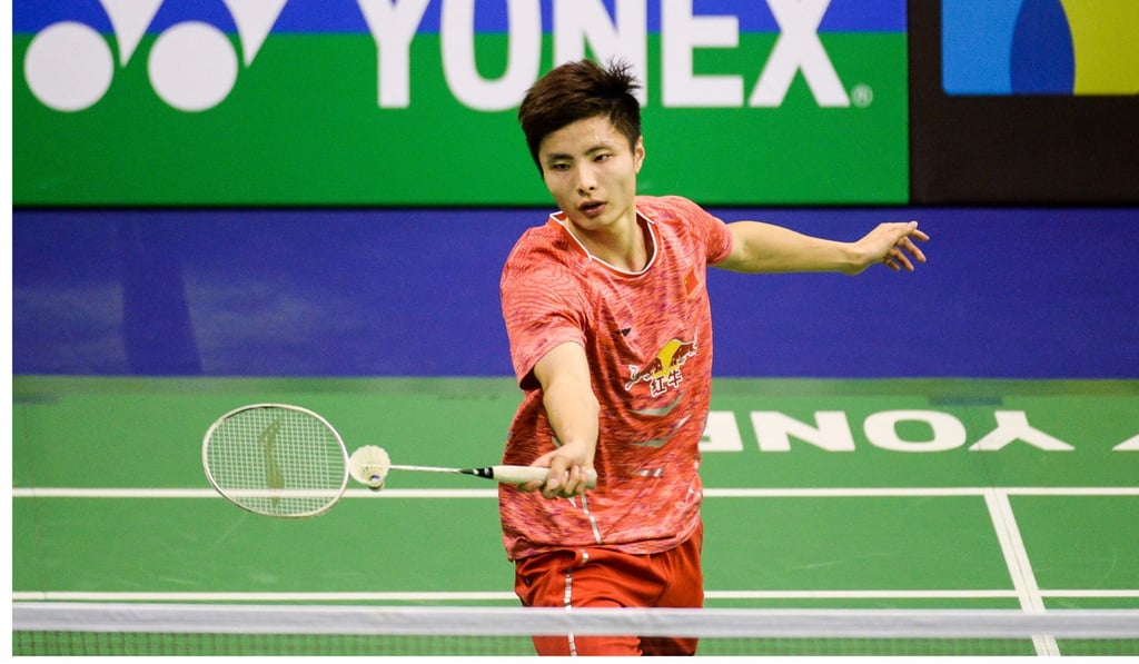 China's Shi Yuqi plays a placement shot against China's Lin Dan.