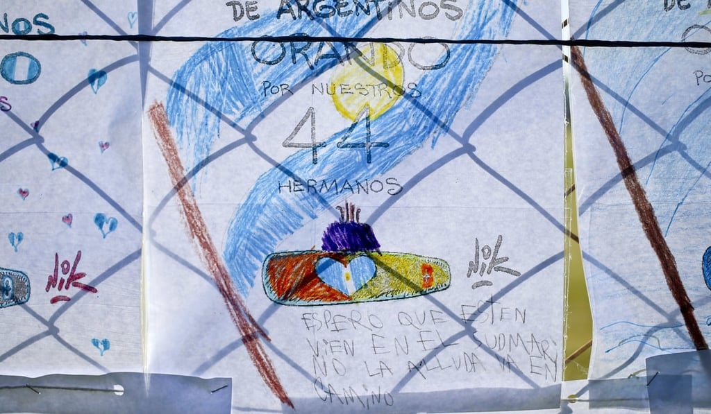 Children's drawings depicting the missing ARA San Juan submarine hang on a fence enclosing the Mar del Plata Naval Base in Argentina. Photo: AP Children's drawings depicting the missing ARA San Juan submarine hang on a fence enclosing the Mar del Plata Naval Base in Argentina. Photo: AP
