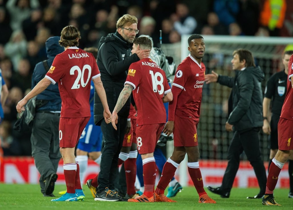 Juergen Klopp embraces Alberto Moreno (C) after the Premier League match against Chelsea. Photo: EPA