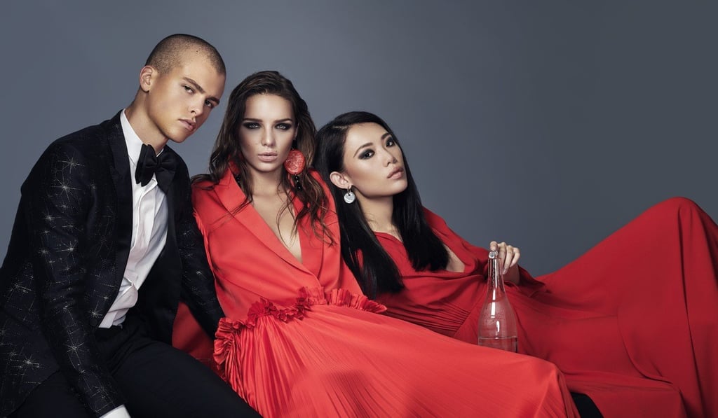 ON HIM: LANVIN Jacket & Trousers, HK$$20,600; BOTTEGA VENETA bowtie, HK$1,600; ON HER (middle) GIVENCHY Overcoat Dress, HK$45,800 and Trousers, HK$13,800; GIORGIO ARMANI earrings, HK$2,200; ON HER (right) DIOR dress, HK$47,000; GLASSWARE BOTTEGA VENETA varying prices; TIFFANY diamond point sterling silver corkscrew HK$3,950