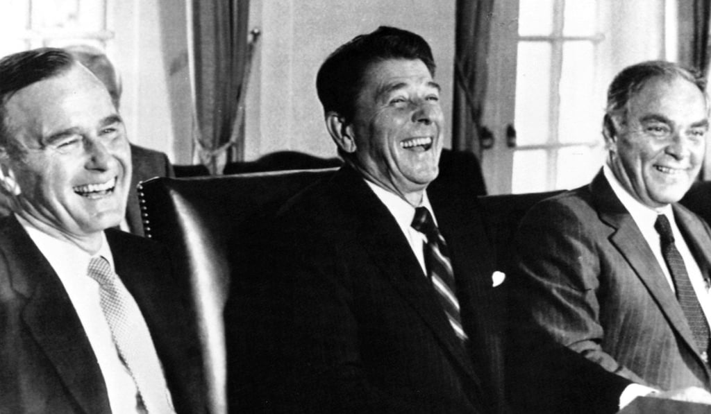 Then US president Ronald Reagan (centre) enjoys a lighter moment with vice-president George Bush (left) and secretary of state Alexander Haig in the White House Cabinet Room on September 9, 1981. One of Reagan’s first major pieces of legislation was the Economic Recovery Tax Act of 1981, which cut all marginal tax rates, and which supporters credit for the economic expansion that took place during Reagan’s administration, even though the national debt accelerated. Photo: AP