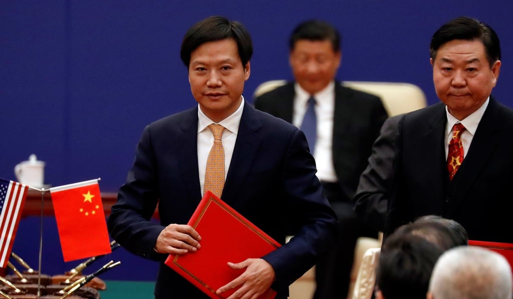 Lei Jun, (left) founder and chief executive of China's smartphone maker Xiaomi, attends a signing ceremony and meeting of business leaders with US President Donald Trump and China's President Xi Jinping at the Great Hall of the People in Beijing earlier this month. Photo: Reuters