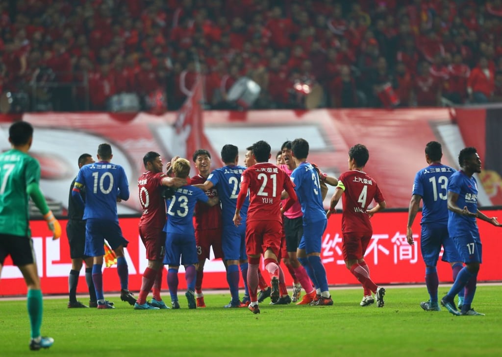 A brawl breaks out between Shanghai SIPG and Shenhua players during a fiery Cup final. Photo: AFP A brawl breaks out between Shanghai SIPG and Shenhua players during a fiery Cup final. Photo: AFP