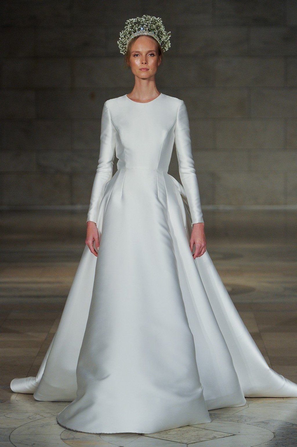Trinity Bridal Reem Acra’s long-sleeved ‘Captivating’ wedding gown gives timeless silhouettes a new tone. Trinity Bridal Reem Acra’s long-sleeved ‘Captivating’ wedding gown gives timeless silhouettes a new tone.