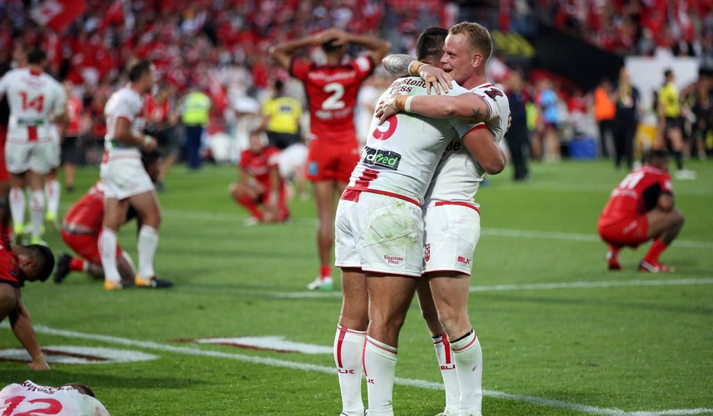 England’s Ryan Hall (left) and Kevin Brown celebrate after the final whistle. Photo: AFP