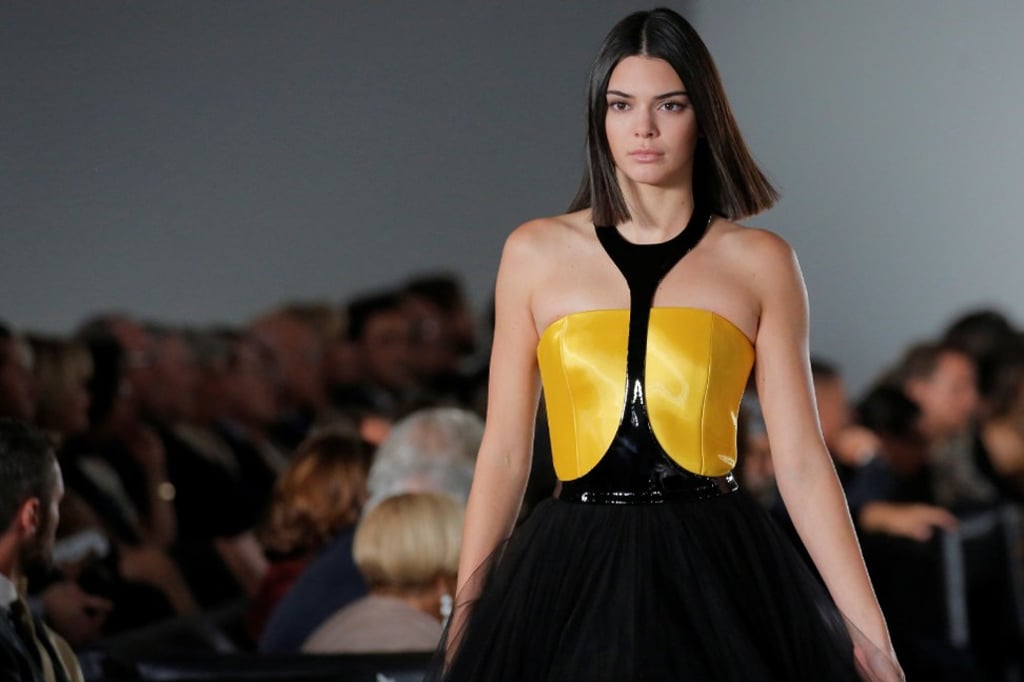 Model Kendall Jenner presents a Ralph Lauren creation at the fashion show in Lauren’s private garage in New York in September 2017. Photo: Reuters