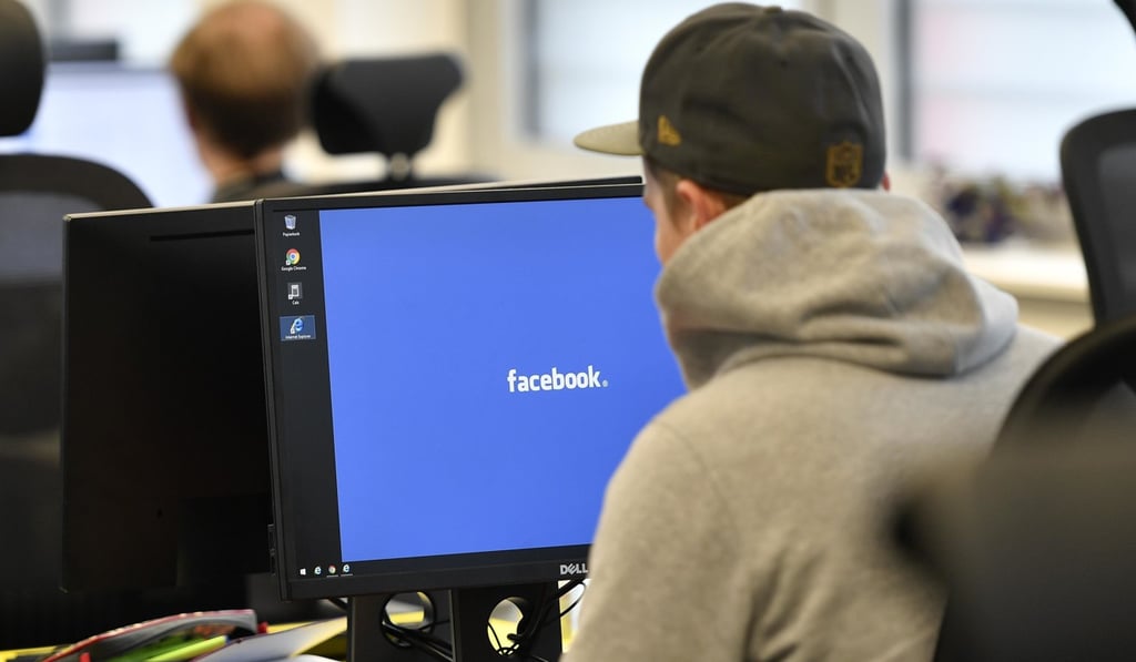 Employees of the Competence Call Centre (CCC) work for the Facebook Community Operations Team in Essen, Germany. Photo: AP Employees of the Competence Call Centre (CCC) work for the Facebook Community Operations Team in Essen, Germany. Photo: AP