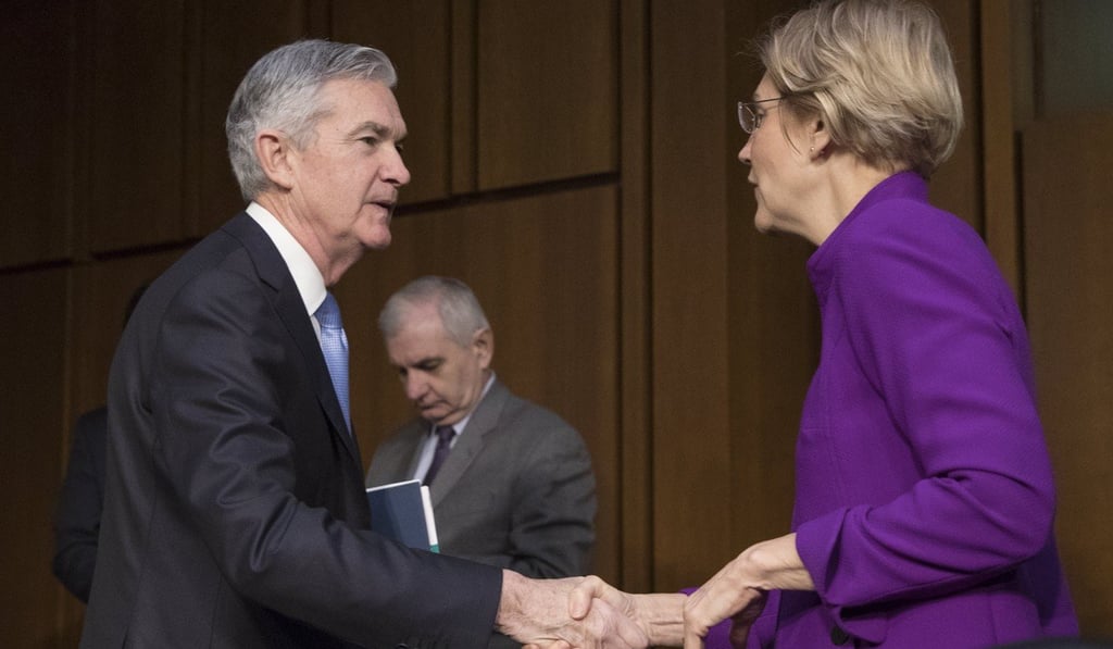 Jerome Powell (L) shakes hands with Democratic Senator from Massachusetts Elizabeth Warren (R), upon arrival to testify at the Senate Banking, Housing and Urban Affairs Committee hearing on his nomination to be chairman of the Federal Reserve. Photo: EPA-EFE
