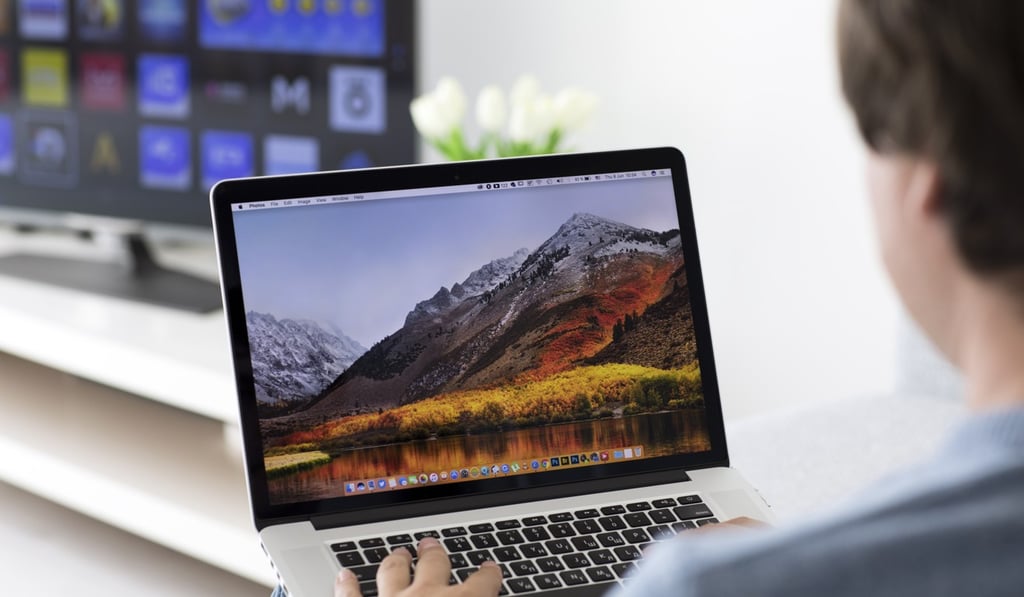 Someone using a Mac laptop with MacOS High Sierra installed. Photo: Shutterstock