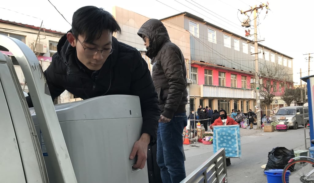 People move out of the two-storey building in Daxing, an outer district south of the Beijing city centre, where a fire killed 19 people. Photo: Simon Song People move out of the two-storey building in Daxing, an outer district south of the Beijing city centre, where a fire killed 19 people. Photo: Simon Song