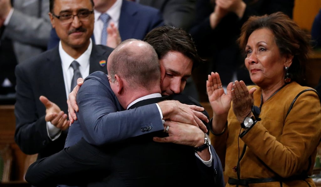 Canada's Prime Minister Justin Trudeau hugs Liberal MP Randy Boissonnault, Special Advisor to the Prime Minister on LGBTQ issues, after delivering his apology. Photo: Reuters