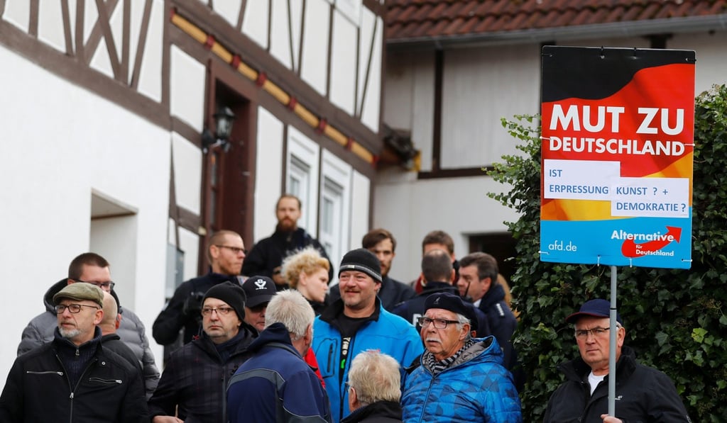 Supporters of the anti-immigrant Alternative for Germany block the entrance to a property which was used by a German political art group to built a pared-down version of Berlin's Holocaust memorial next to the home of AFD senior member Bjoern Hoecke, in Bornhagen, Germany, on November 22. In January, Hoecke criticised the memorial in the centre of Berlin and said history should focus on German victims. Photo: Reuters