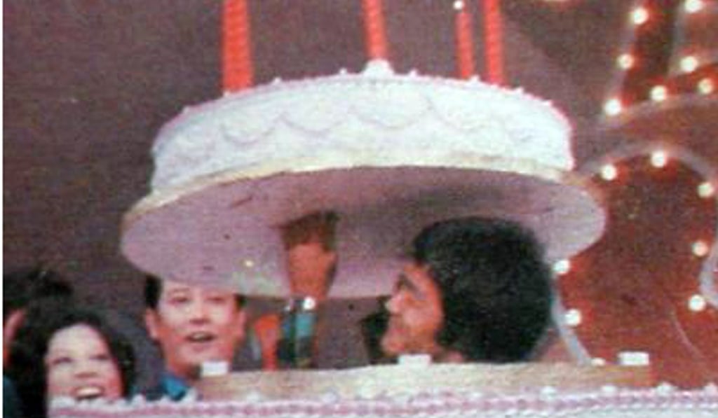 Martial arts star and actor Bruce Lee emerging from a cake on the show Enjoy Yourself Tonight in 1973. Photo: Robert Chua Martial arts star and actor Bruce Lee emerging from a cake on the show Enjoy Yourself Tonight in 1973. Photo: Robert Chua