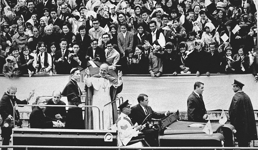 Pope Paul VI greets the crowds during his visit to Hong Kong on December 4, 1970.